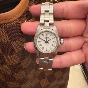 Rolex Silver Timepiece with White Face Ladies Rolex 24mm date just